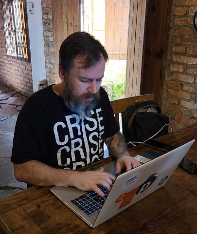 Ponte Jornalismo Editor Amauri Gonzo types at his laptop, in Sao Paulo, Brazil.