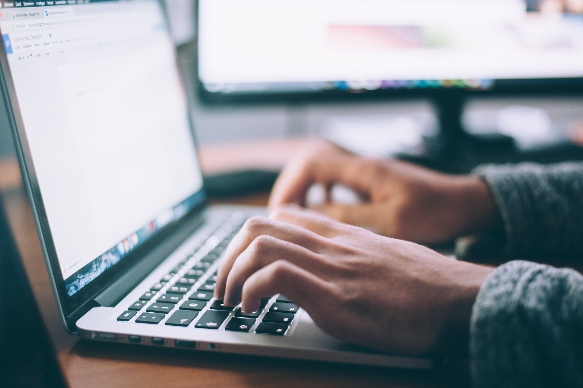 A person uses a laptop