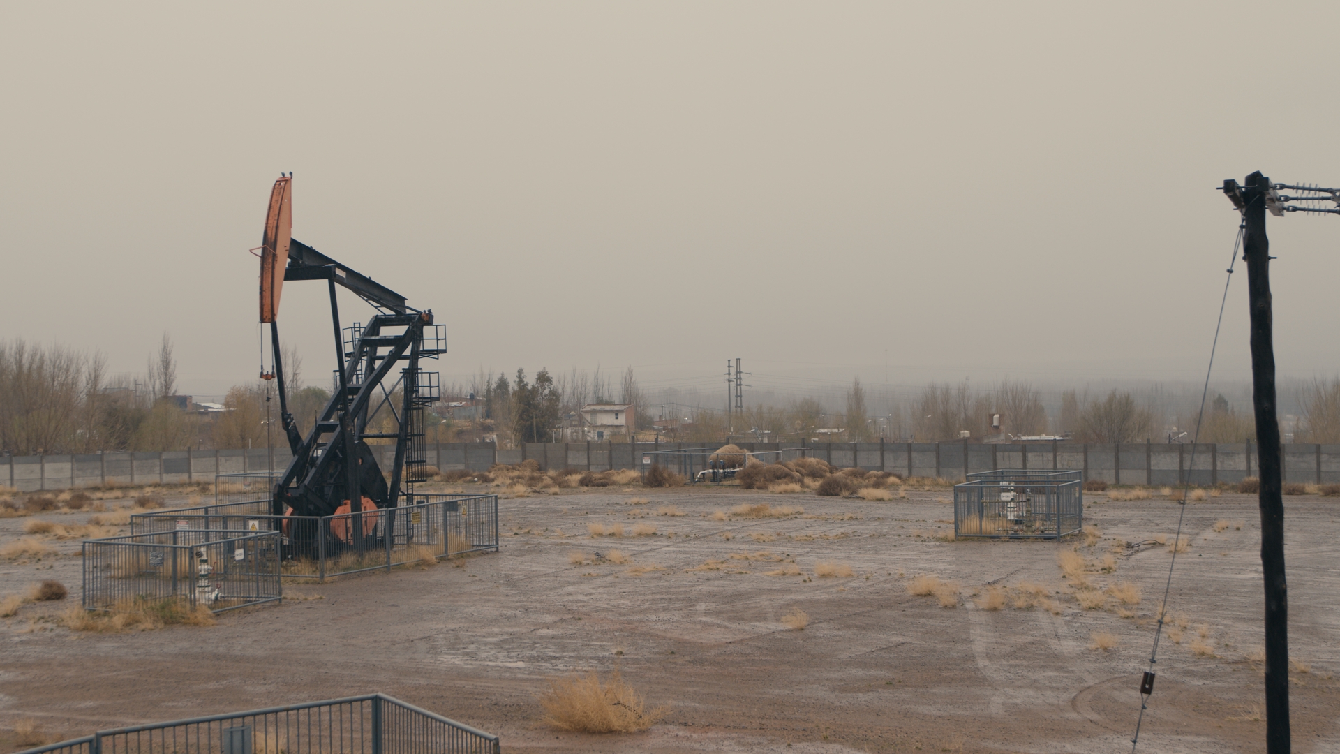 An oil pumpjack and other extraction infrastructure sits on Indigenous territory in Neuquén, Argentine Patagonia.  