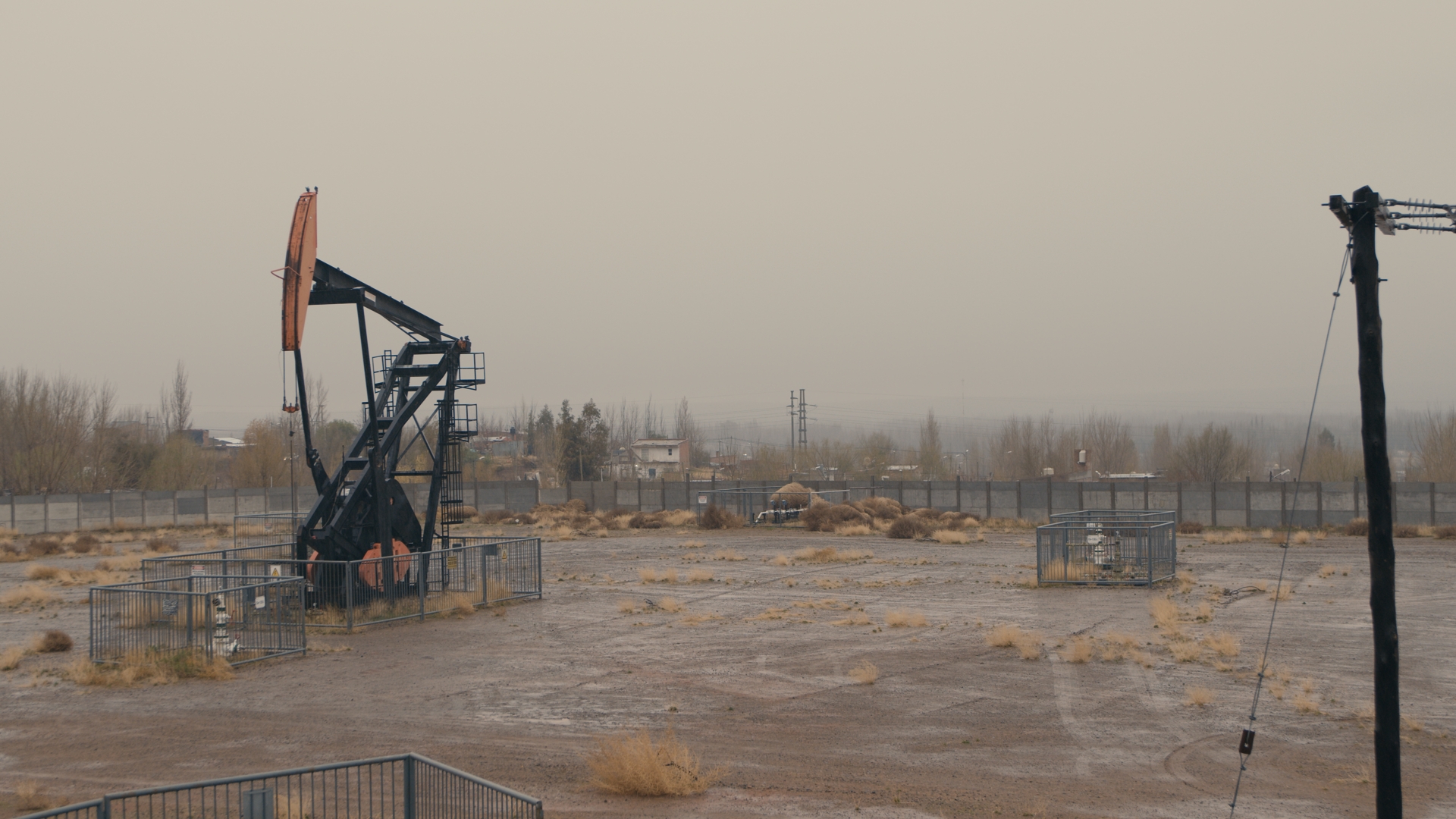 An oil pumpjack and other extraction infrastructure sits on Indigenous territory in Neuquén, Argentine Patagonia.