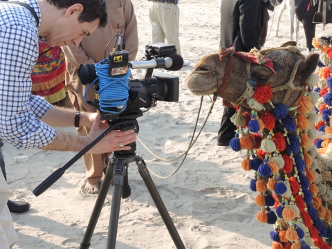 Mark Albert in Karachi photographing a camel