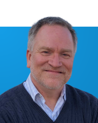 Portrait of Patrick Butler on a blue background